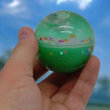 Фото2.Мʼячик-стрибунець, прозорий, з рідиною (5,5 см), зелений