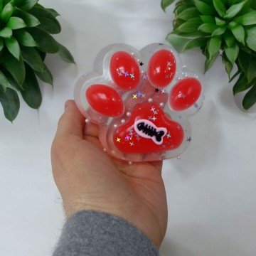 Фото1.Лапка-антистрес (11 см) таба, прозоро-червона