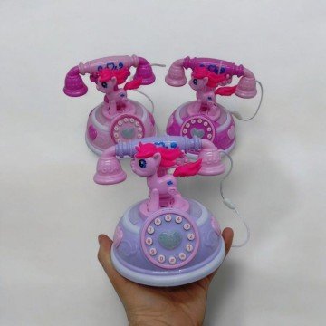 Фото2.Телефон музичний на батарейках (малиновий)