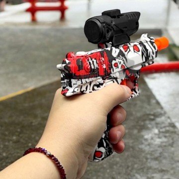 Фото1.Пістолет стріляє орбізами, в коробці (Білий+чорний+червоний)