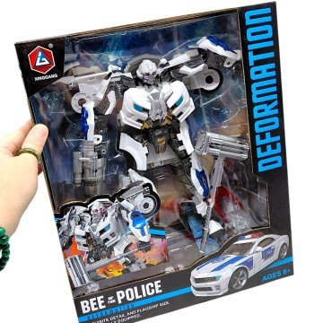 Фото1.Трансформер (металеві елементи, зброя, інструкція) коробка