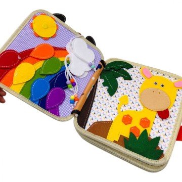 Фото1.Мʼяка книжка-бізіборд 