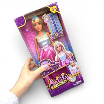 Фото1.Лялька висота: 30 см, голова та руки: гума, тіло та ноги: пластик, знімна сукня та взуття, діадема, 